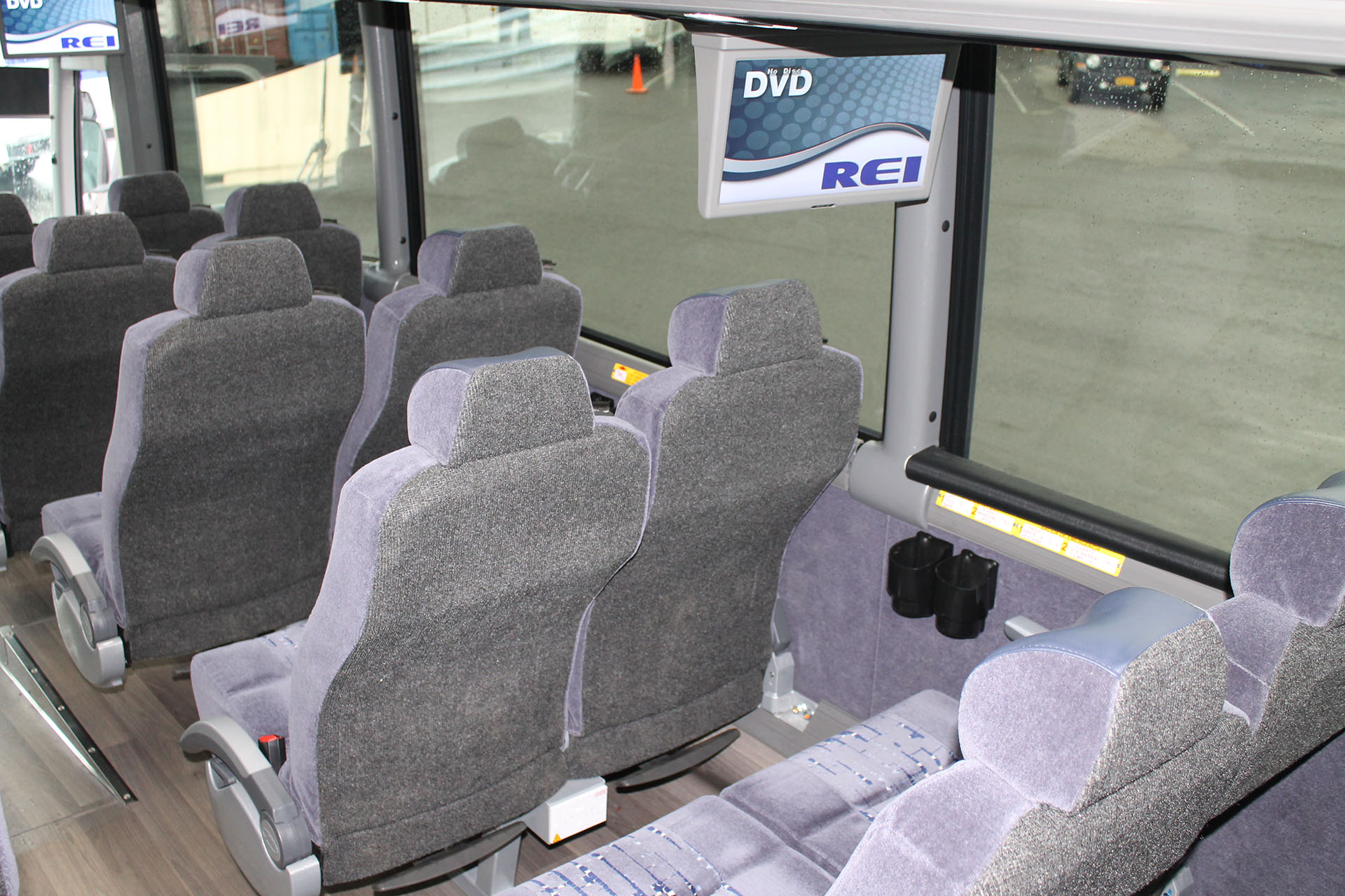 Seats and DVD player inside a 54 passenger motorcoach